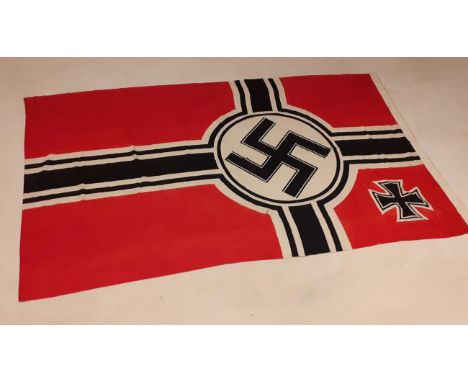 A German Third Reich Kriegsmarine Battle Flag, in printed linen, the hoist stencilled Reichskriegsflg. 1,5 X 2,5 and with eag