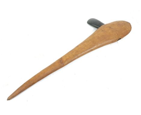 A Dani, Papua New Guinea Axe, with green stone blade inserted into the heavy hardwood haft of flattened form with tapering ha