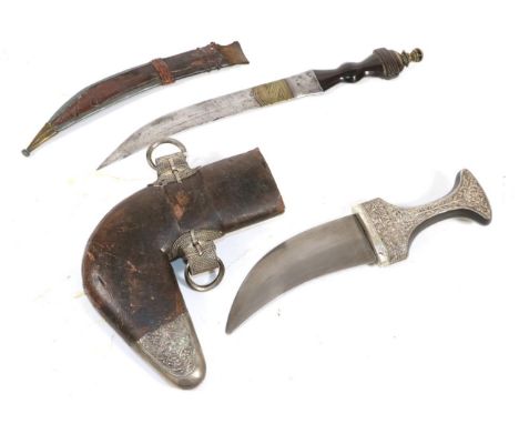 A 20th Century Omani Jambiya, with 14.5cm double edge curved steel blade, the horn grip with silver mounts embossed with flow