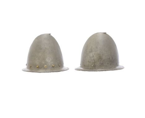 Two Spanish Morions Or Cabassets North Italian, Late 16th CenturyEach of dulled grey iron and made in one piece, almond-shape
