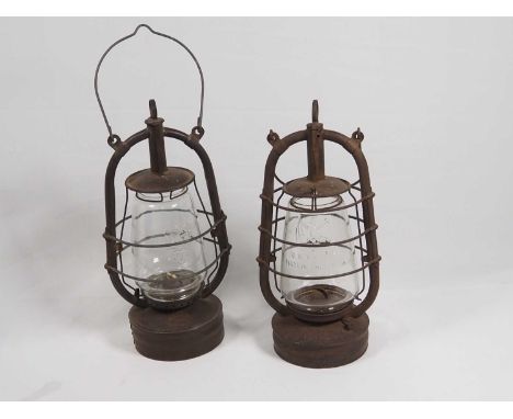 Two Early-20th century Storm Lanterns; Veritas Pax Made in England embossed with an Elephant on glass; another German, Thurin