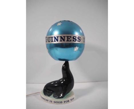 GUINNESS: Carlton Ware Sealion Lamp with revolving globe lampshade - in working order - c1963 limited edition of 2500 - 36cm 