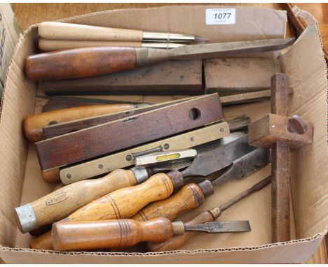 An assortment of wood working tools including chisels 