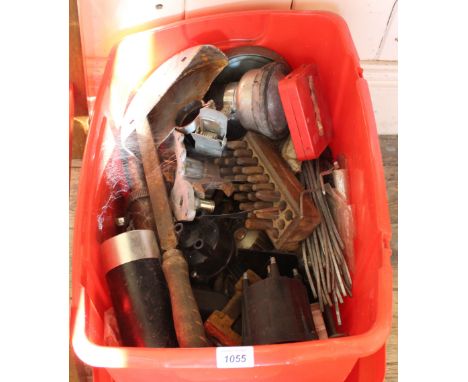 A collection of assorted tools in a plastic container