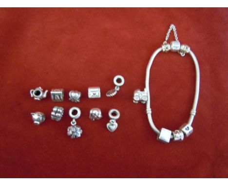 Pandora silver Bracelet with 14 charms, Older edition including Teapot, Pram, Pig,  Butterflies etc. A lovely bracelet with a