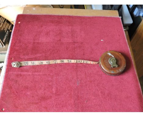 Vintage Leather Cased tape measure, measures 33 feet long. Made by Holkey Abbey, Sweland. Marked P.C.W, Gooch.