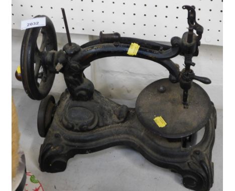 A hand operated Singer sewing machine.