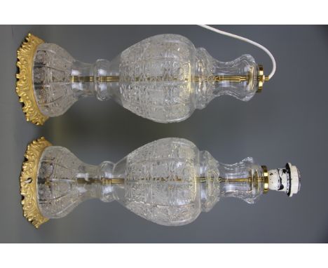 A pair of ormolu mounted cut crystal lamp bases, H. 42cm.