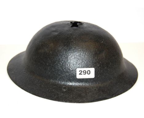 A World War I helmet understood to have been retrived from the battle of the Somme with applied preservative.