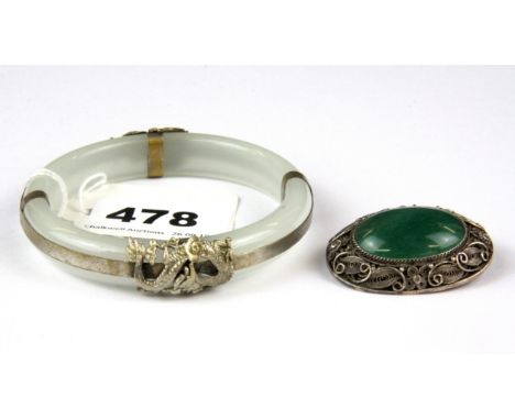 A Chinese filigree silver and jade brooch and a white jade bangle.