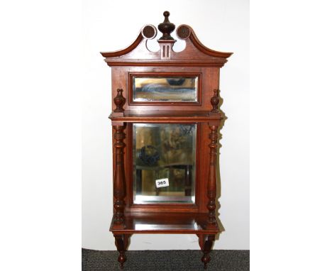 An Edwardian mahogany mirrored wall shelf, H. 77cm.