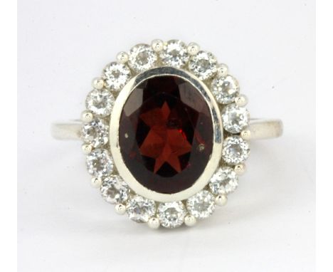 A 925 silver garnet and white topaz set cluster ring, (N).