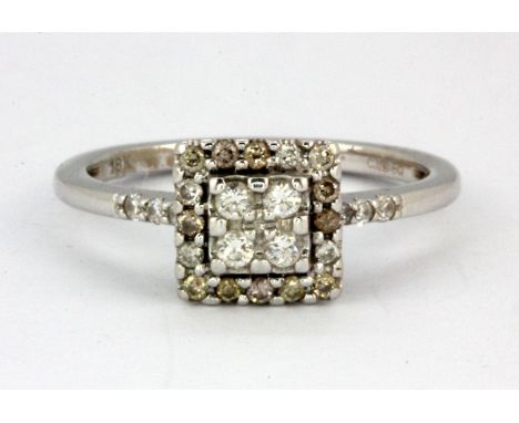 An 18ct white gold diamond set cluster ring, (P).