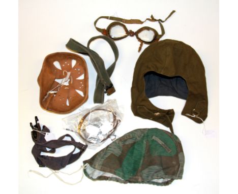 A Russian Post War canvas tank helmet with goggles and other various items.