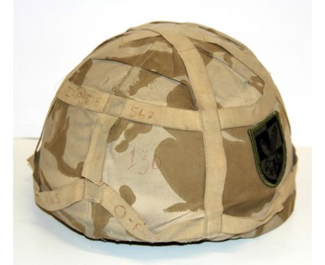 A year 2000 Nato dessert army helmet.