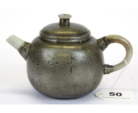 A Chinese pewter overlaid terracotta teapot with jade spout and handle, H. 10cm.