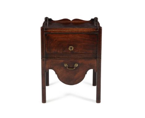 A George III mahogany night commode, circa 1780, the rectangular top with shaped gallery, above a sliding retractable door an