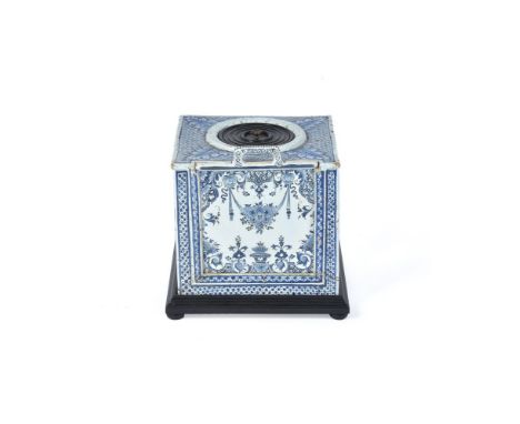 A French faience blue and white portable commode or 'thunderbox', 18th century, possibly Lille, painted with floral swags in 