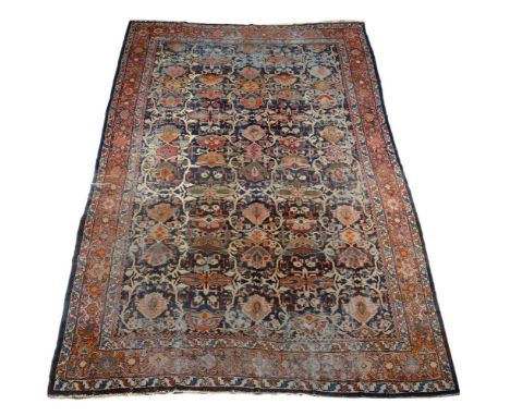 A Ziegler Mahal carpet, the dark blue field decorated with an overall design of meandering vines interspersed throughout with