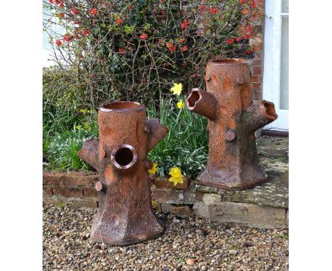 A pair of salt glazed terracotta 'faux bois' strawberry planters, last quarter 19th century, probably Scottish, each modelled