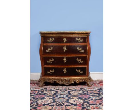 A Danish figured walnut and parcel gilt serpentine commode, second half 18th century, the mottled marble top above four long 