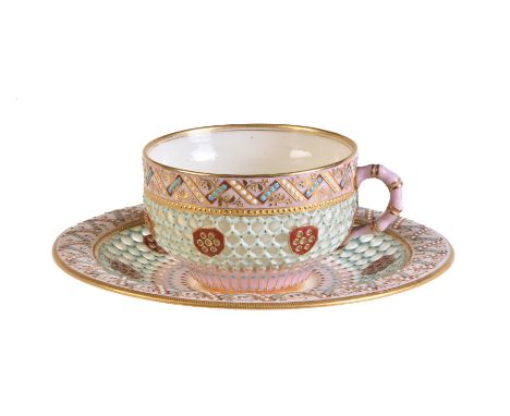 A Royal Worcester reticulated cup and saucer of George Owen type, last quarter 19th century, painted in shades of pink, blue,