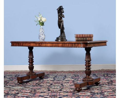 A George IV mahogany library table, by Gillows, circa 1825, the rectangular top with rounded corners and moulded edge, above 