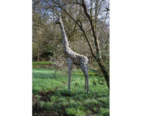 A large patinated metal garden model of a standing giraffe, late 20th century, 376cm high