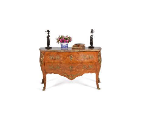A Louis XV tulipwood and floral marquetry serpentine commode, circa 1760, gilt metal mounted throughout, the shaped marble to