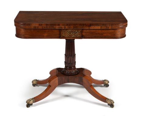 ϒA Regency rosewood and brass marquetry folding card table, circa 1815, the hinged rectangular top with rounded corners, revo