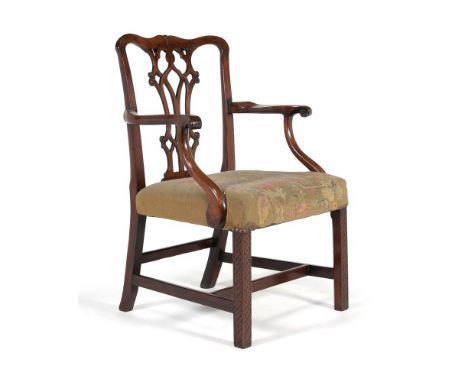 A George III mahogany armchair, circa 1760, in the manner of Thomas Chippendale, the shaped back with pierced vase shaped spl