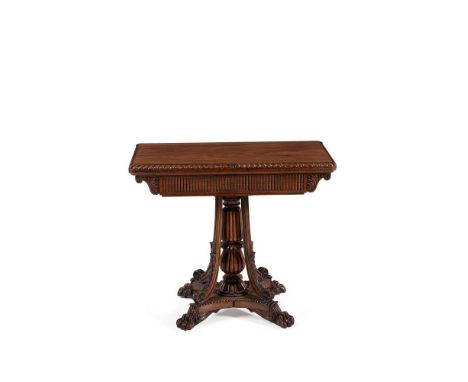 An Anglo Indian carved padouk folding card table, circa 1820, the folding rectangular top with guilloche carved edge opening 