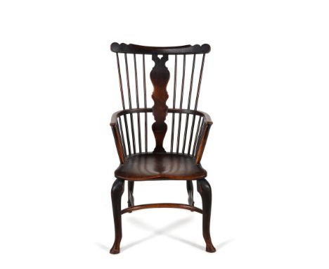 A George II elm, ash and walnut 'comb' back Windsor armchair, mid-18th century, from the Thames Valley region, the shaped top