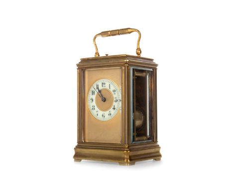 FRENCH REPEATING CARRIAGE CLOCK, LATE 19TH CENTURY the gilt dial set with a off-white enamel Arabic numeral chapter ring, con