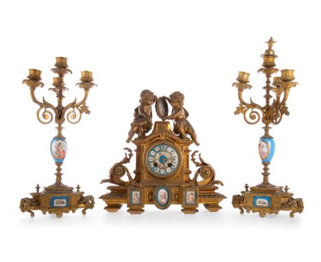 FRENCH GILT METAL AND PORCELAIN CLOCK GARNITURE, LATE 19TH CENTURY the clock with two train right day movement striking on a 