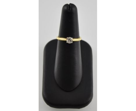 An 18 carat yellow gold solitaire diamond ring the claw set stone 0.50 carat