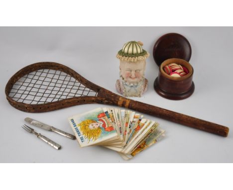 A 1920s C W Faulkner & Co. 'Misfitz' nursery ryhme/fairy story card game, together with a doll's tennis raquet and knife & fo