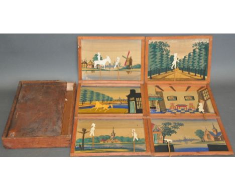 An early 20th century Dutch shadow puppet theatre, with six hand-painted linen backdrops and numerous card silhouettes, many 