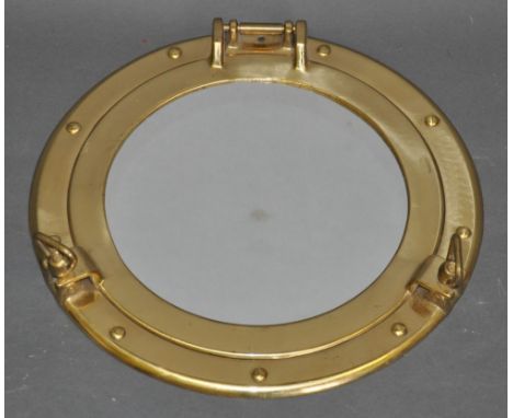 A circular mirror, modelled as a vintage-style brass porthole, Dia. 30cm
