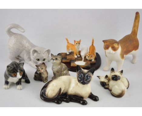 For feline fanciers: four Beswick glazed ceramic figures/groups, together with a studio pottery figure , two further ceramic 