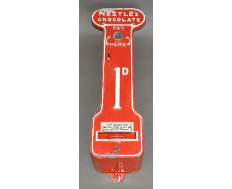 A vintage Nestle Chocolate wall-mounted, galvanised, coin operated vending machine, later painted.  With key. H. 74cm