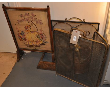 An early 20th Century tubular brass mesh spark guard together with a tapestry firescreen and one other scuttle and fender