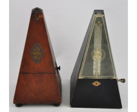 A vintage Maelzel French metronome with adjustable interval chime, together with another similar