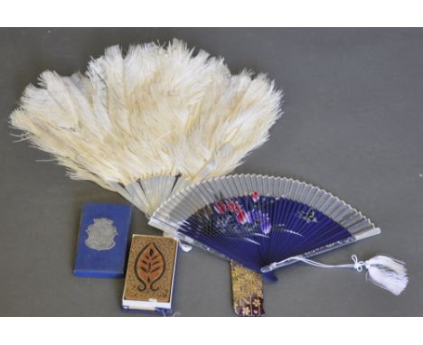 A vintage ostrich feather and faux mother-of-pearl fan, together with another, and a deck of vintage Piatnik Tarock playing c