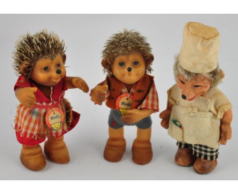 Three vintage Steiff vinyl hedgehog figures: Macki, Mucki (both with original card tags), and a very cheerful chef, H. 12cm (