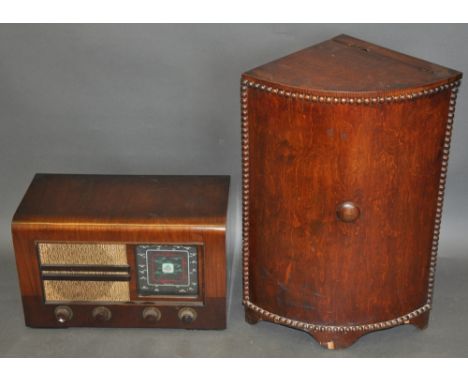 A 1920s corner cabinet with hinged lid on bracket feet, the curved front with beaded border, H. 65cm, together with a vintage