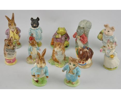 Twelve Beswick Beatrice Potter glazed ceramic figures, mostly 1940s and 1950s, together with a boxed novelty Winnie the Pooh 