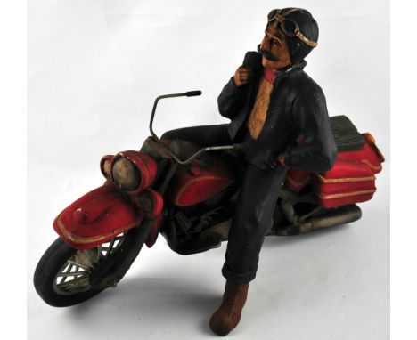 A reproduction vintage style model of a  Harley Davidson and rider