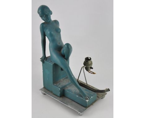 An Art Deco blue plaster and chrome table lamp modelled as a seated reclining nude, h:33cm