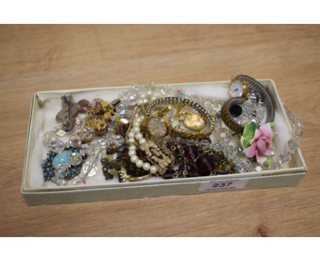 An assorted collection of jewellery, including a ladies Rotary wristwatch, decorative brooches, a faceted glass necklace, cuf